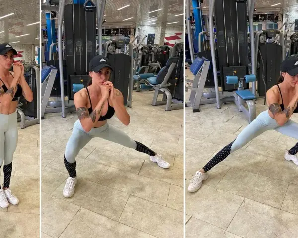 Donna in palestra esegue affondo laterale, lavorando l'adduttore breve.